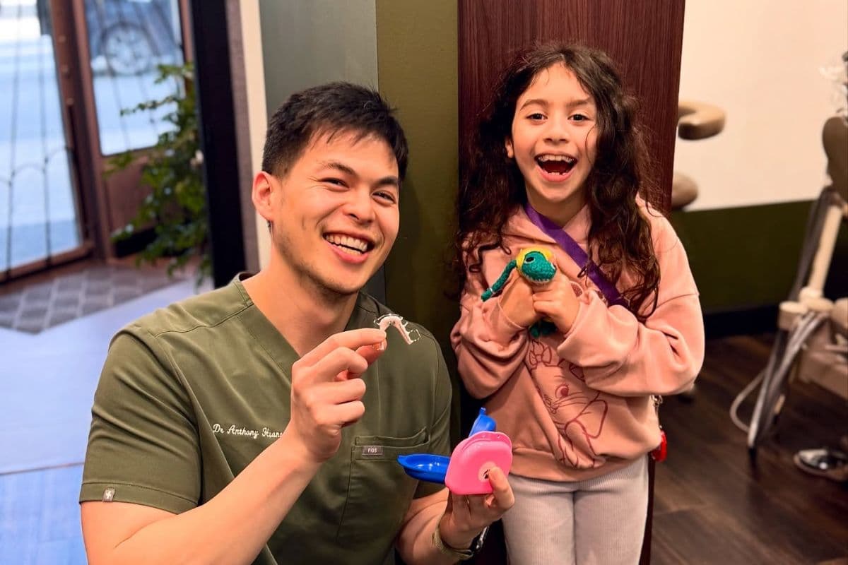 Dentist and child smiling