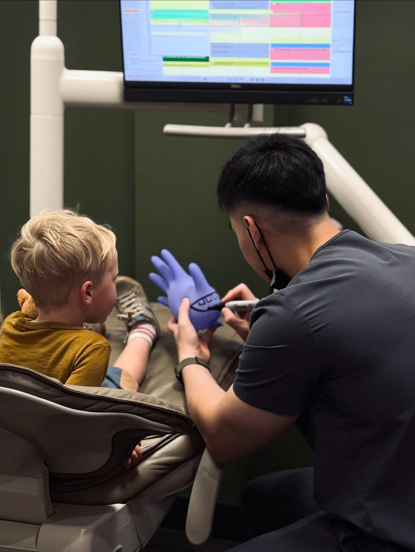 Dentist interacting with a child patient